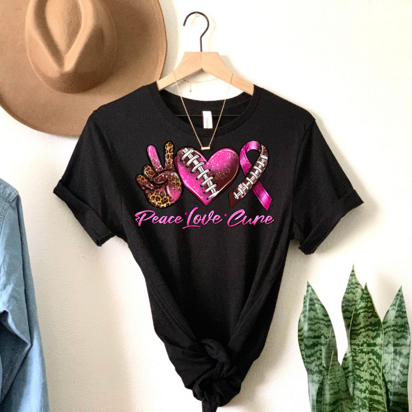 Score for Hope: 'Peace Love Cure' Cancer Football Tee