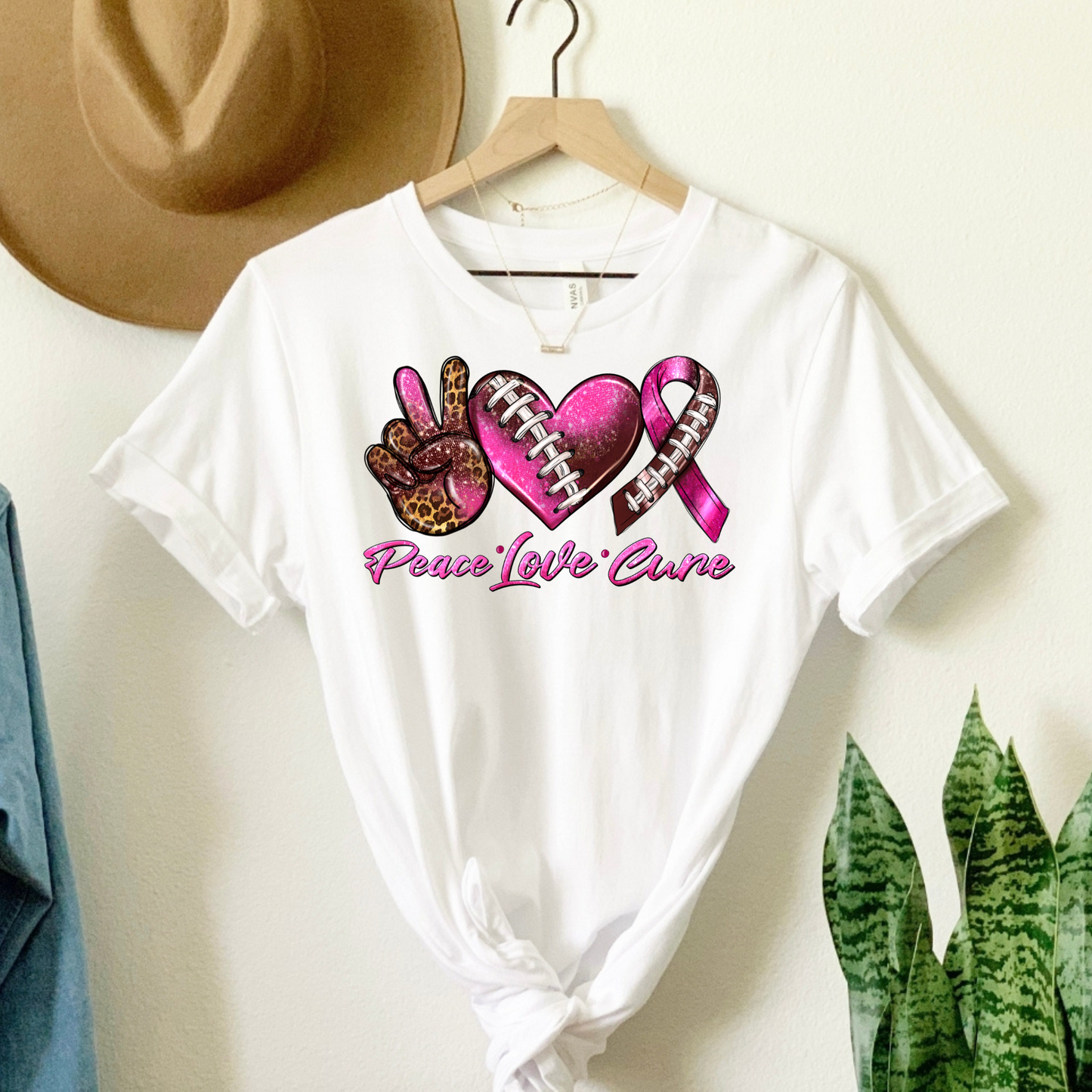 Score for Hope: 'Peace Love Cure' Cancer Football Tee